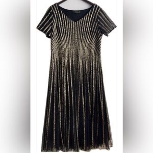 Elegant Black & Gold Fit-and-Flare Dress with Sheer Leopard Print Stripes